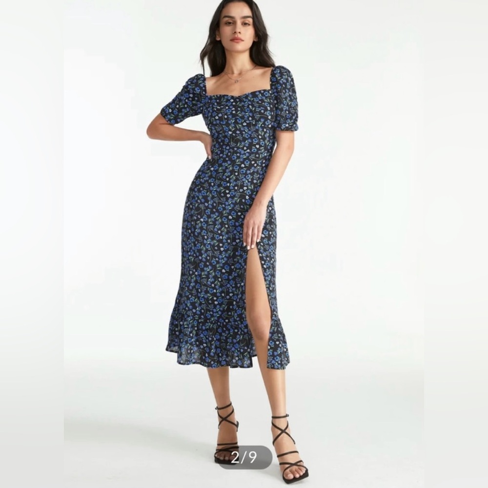 A blue and black floral dress. Has a high slit on the left leg.